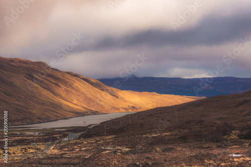 Isle of Skye  dramatic landscape with sunbeam shinning on a mountainside.