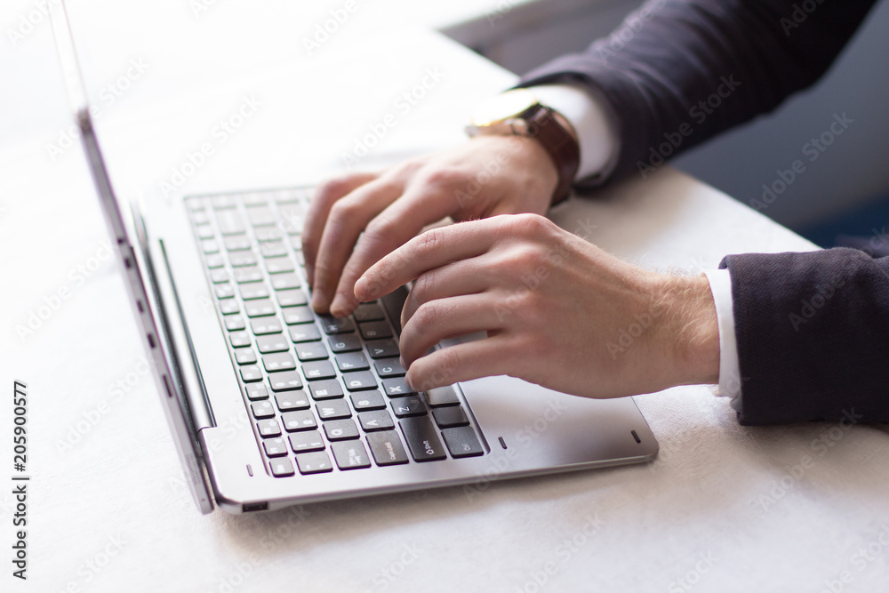 Closeup of businessman typing on laptop. Communicating with partners. Business concept. Closeup of businessman typing on laptop. Communicating with partners. Business concept.