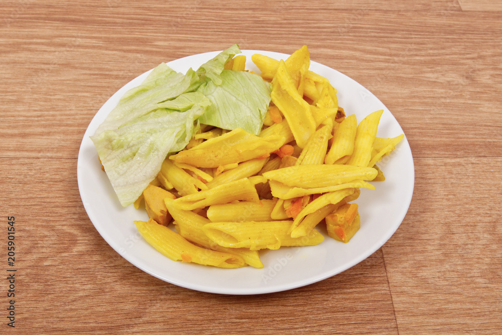 Baked pasta with curry on a table