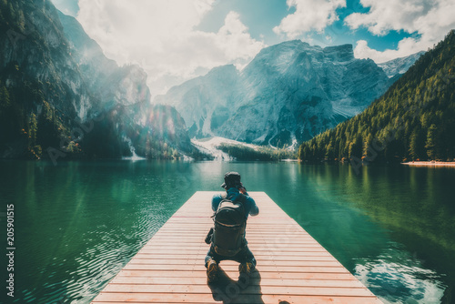 Traveler taking photo of Lake Braies in Italy.