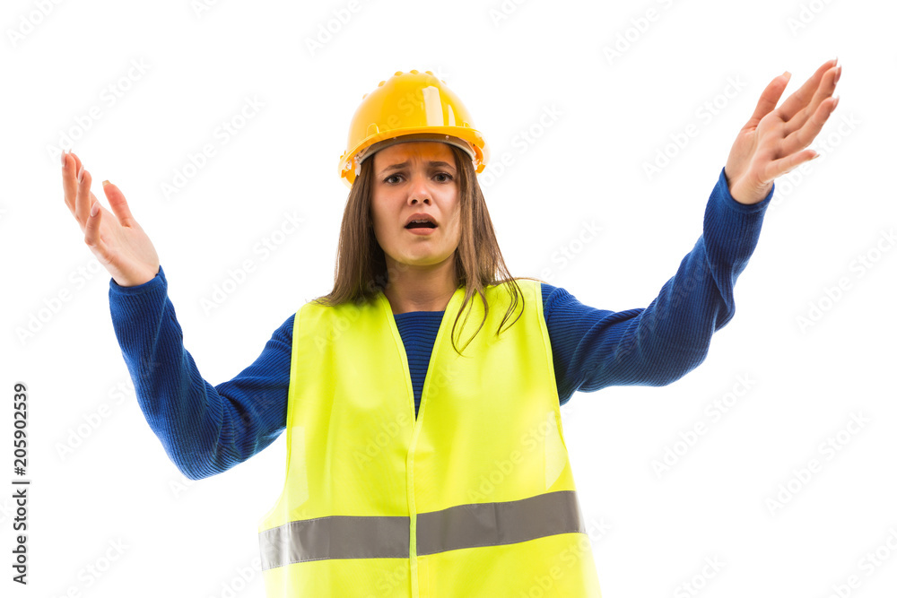 Young female engineer making angry gesture.