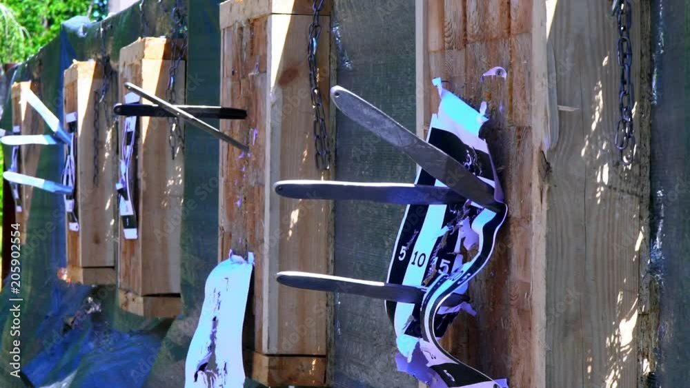 Throwing knives at the target from an openair distance, a competition