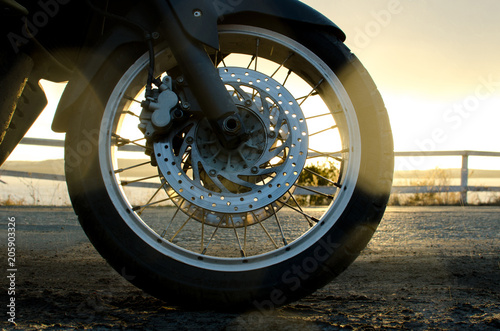 a wheel from a motorcycle on the road