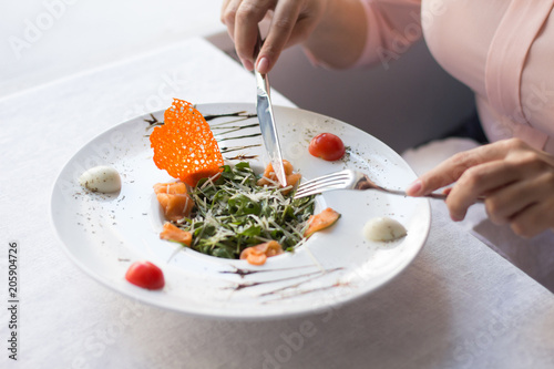 Wallpaper Mural Close up of woman hands holding cutlery. Chef speciality on plate. Torontodigital.ca