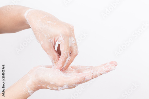 Asian woman hand are washing with soap bubbles on white background Health and Lifestyle Concepts Global Handwashing Day
