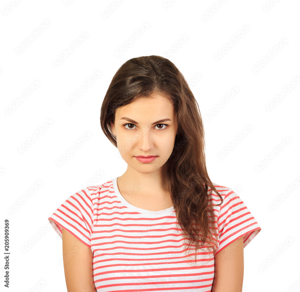 Serious girl looks at the camera. emotional girl isolated on white background Serious girl looks at the camera. emotional girl isolated on white background