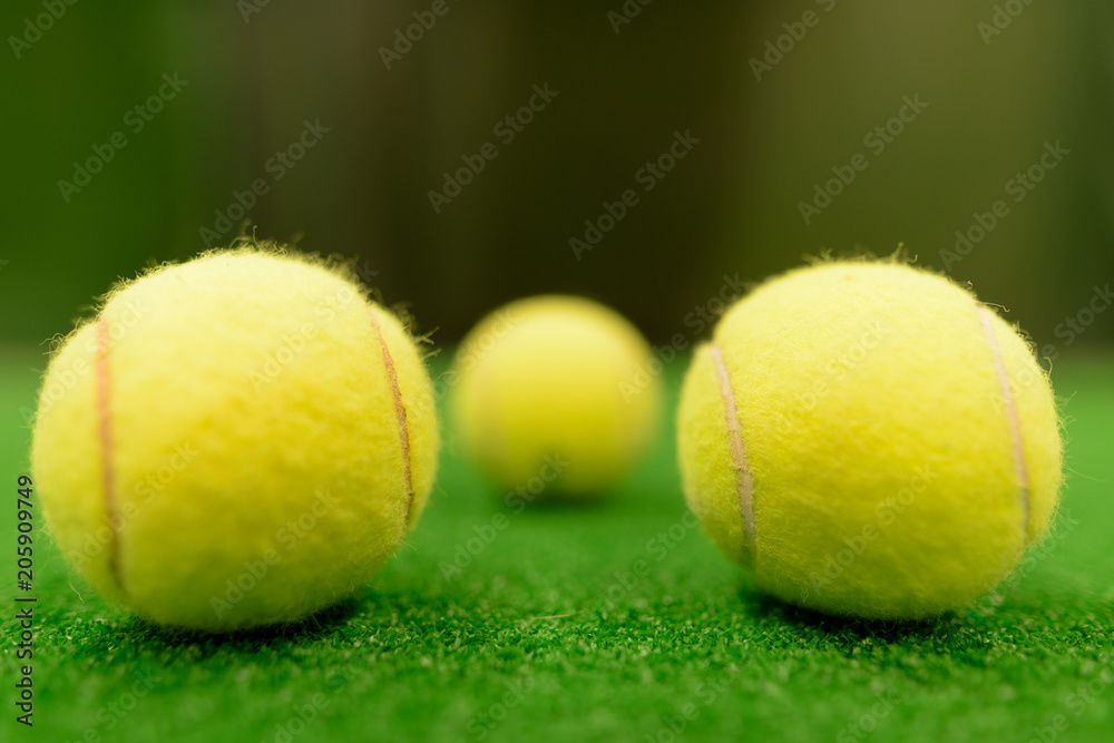 Tennis Balls On Green Surface