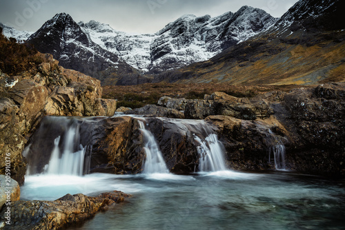 Snowy Mountainous landscape with Waterfalls at Fairy Pools, Brittle River, Isle of Skye, Scot
