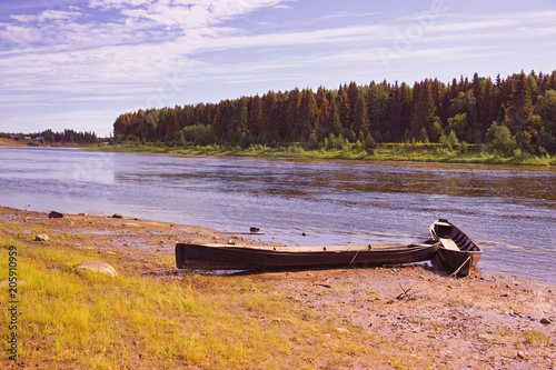 Obraz na płótnie Unusual elongated wooden boats of the Mansi people in Siberia w salonie