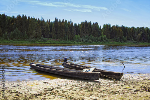 Obraz na płótnie Unusual elongated wooden boats of the Mansi people in Siberia w salonie