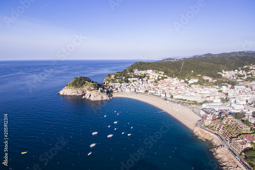 Fototapeta Naklejka Na Ścianę i Meble -  Aerial view of picturesque rocky landscape with fortified walls and residential buildings of Tossa de Mar, Spain