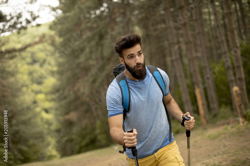 Young bearded man hiking alone on mountain © BGStock72