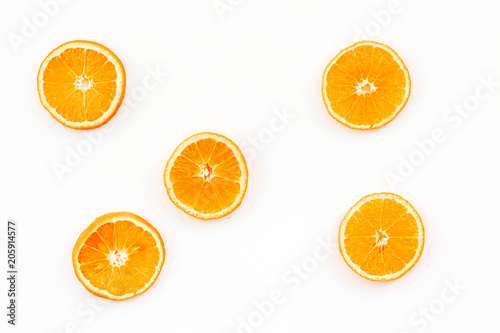 Citrus pattern. Orange round slices composition on white background top view