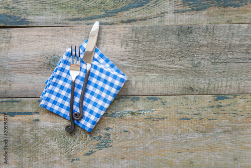 Fnife, fork and napkin are ...