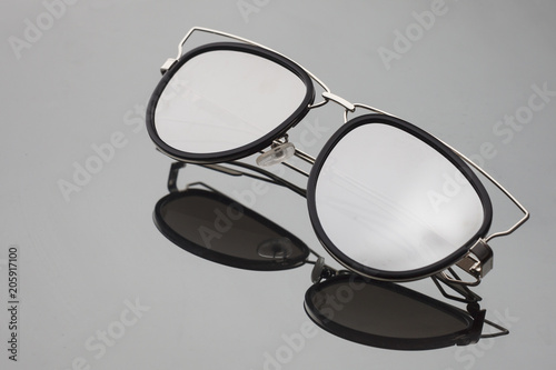 sunglasses with mirror glasses on grey background