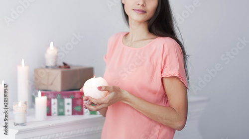 portrait of a young woman with a decorative candle .photo with copy space