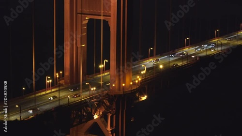 Golden Gate bridge traffic at night. Close up shot - August 2017: San Francisco, California, US