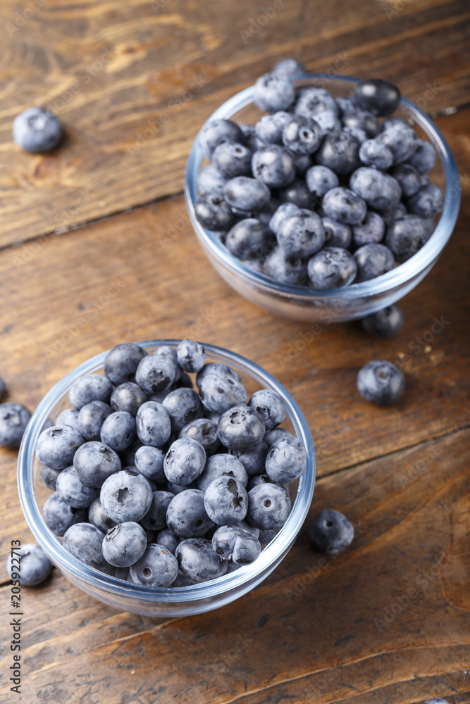 ripe organic bog whortleberry in a wooden plate ripe organic bog whortleberry in a wooden plate