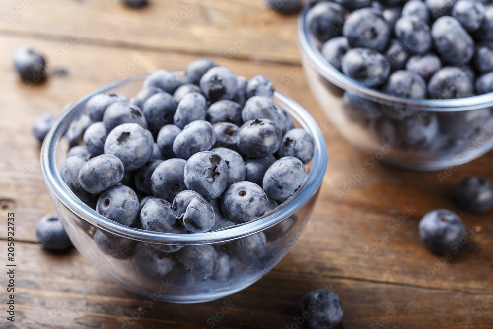 ripe organic bog whortleberry in a wooden plate ripe organic bog whortleberry in a wooden plate
