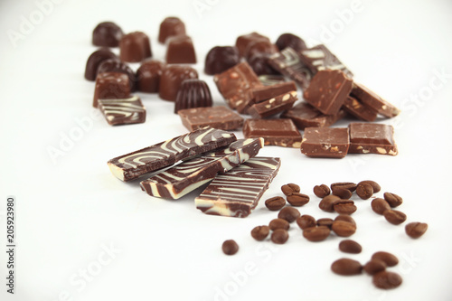 close up.set of chocolate bars and coffee beans. isolated on white.photo with copy space