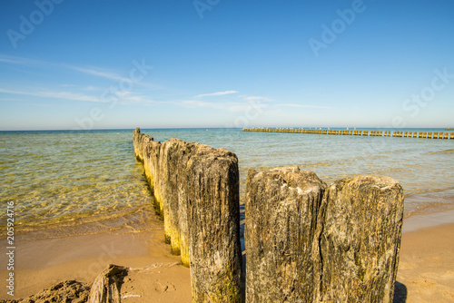 old groins in the Baltic Sea with blue sky