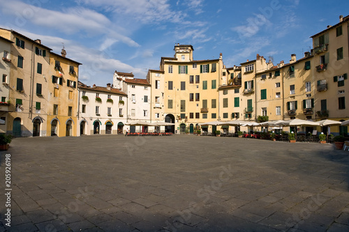 Piazza Anfiteatro in the old town of Lucca. The ring of buildings surrounding the square, follows the elliptical shape of the former Roman Amphitheater of Lucca