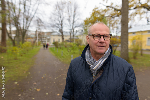 Mature handsome man enjoying life around the city of Turku, Finl