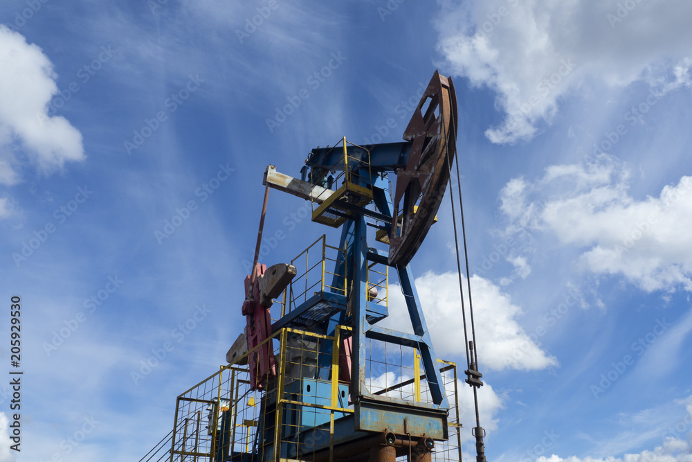 The beam pumping unit is homework, sunset in oil field The beam pumping unit is homework, sunset in oil field