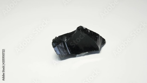 obsidian spinning around over white background
