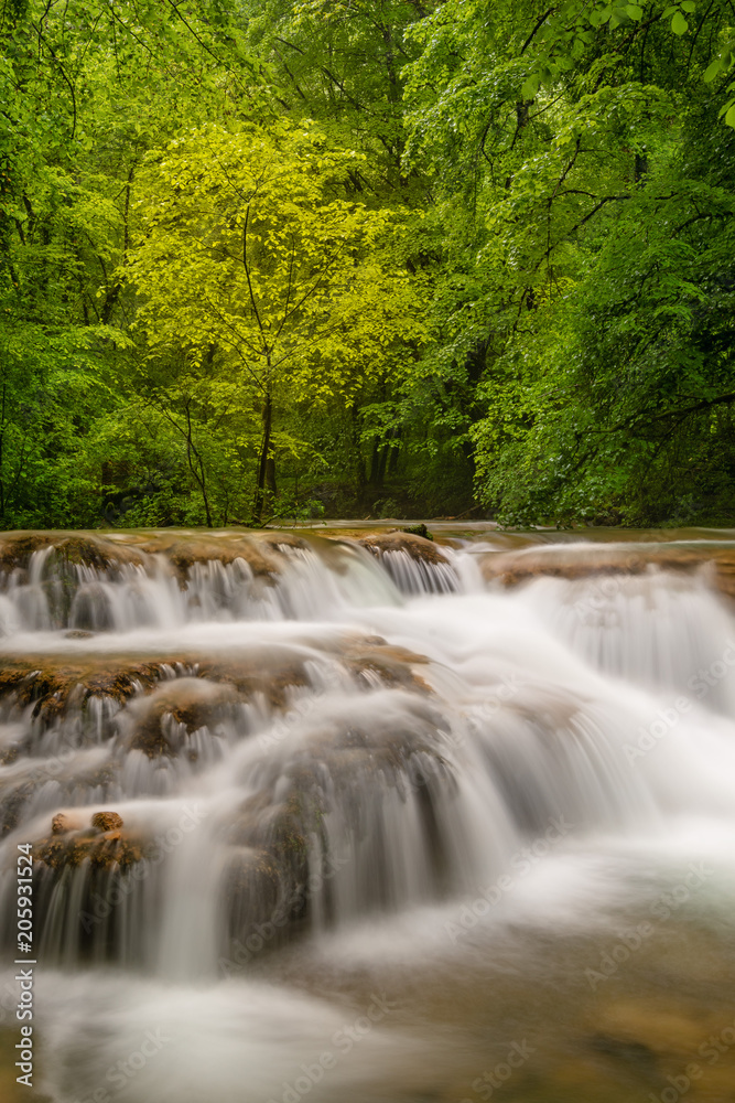 French landscape - Jura. Waterfall in the Jura mountains after heavy rain.