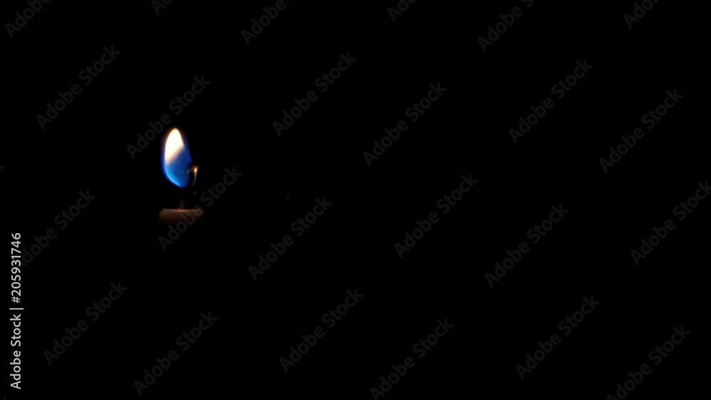 Girl lights candles in total darkness Girl lights candles in total darkness