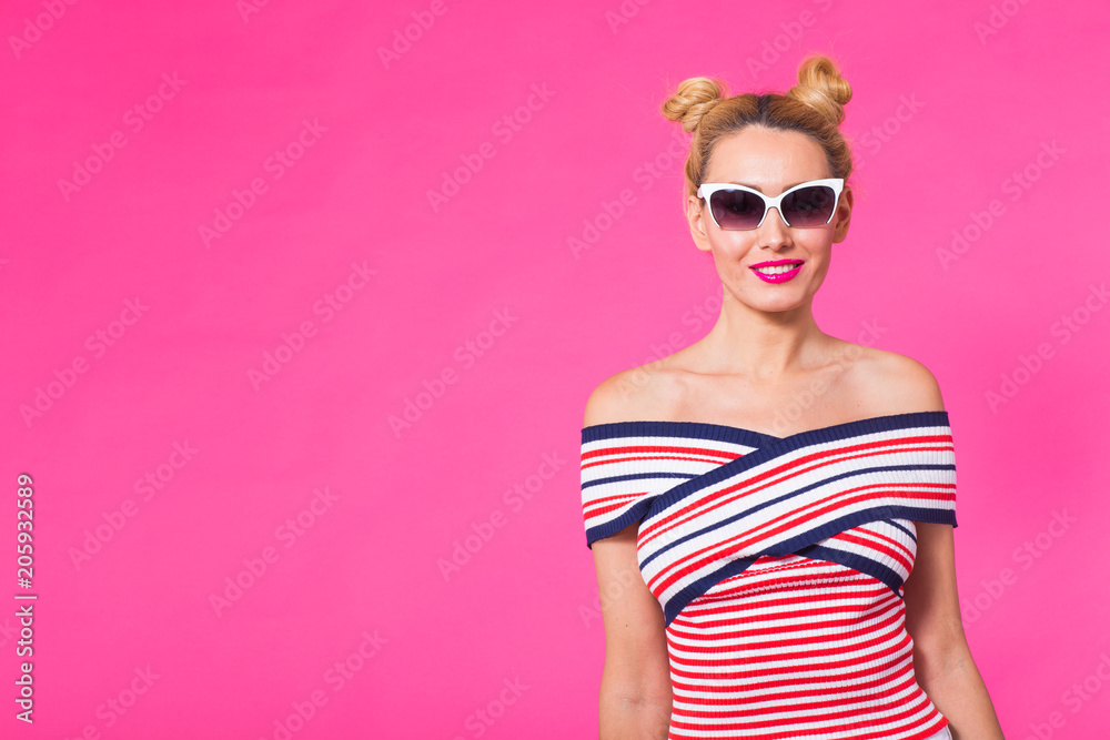 Fashion studio portrait of glamour girl, cute emotions, stylish hipster clothes sunglasses on pink background with copyspace Fashion studio portrait of glamour girl, cute emotions, stylish hipster clothes sunglasses on pink background with copyspace