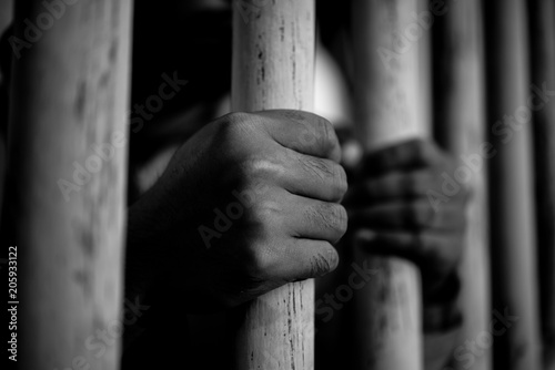 Hands of men desperate to catch the iron prison,prisoner concept,thailand people,Hope to be free,crime should be punished more severely,A person guilty are punished.