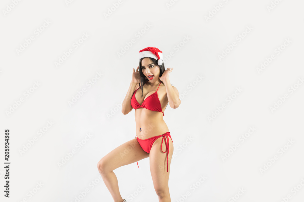 Beautiful happy woman in sexy Santa Claus clothes. Beautiful happy woman in sexy Santa Claus clothes.