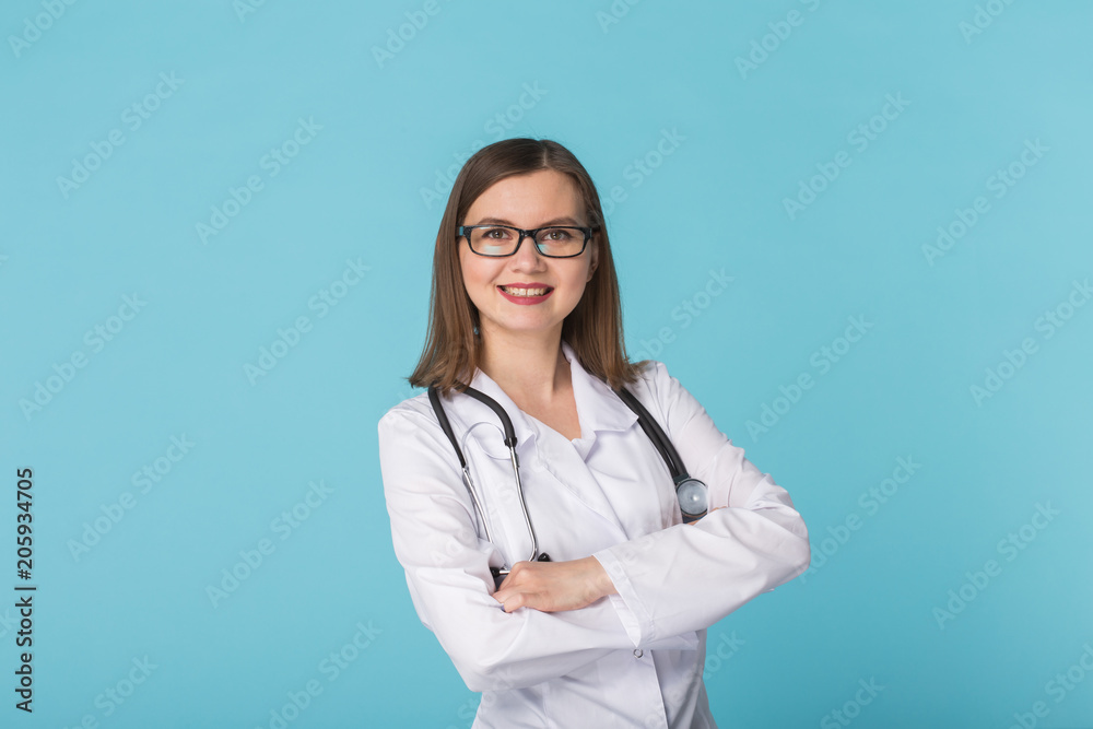 Portrait of woman doctor over blue background Portrait of woman doctor over blue background