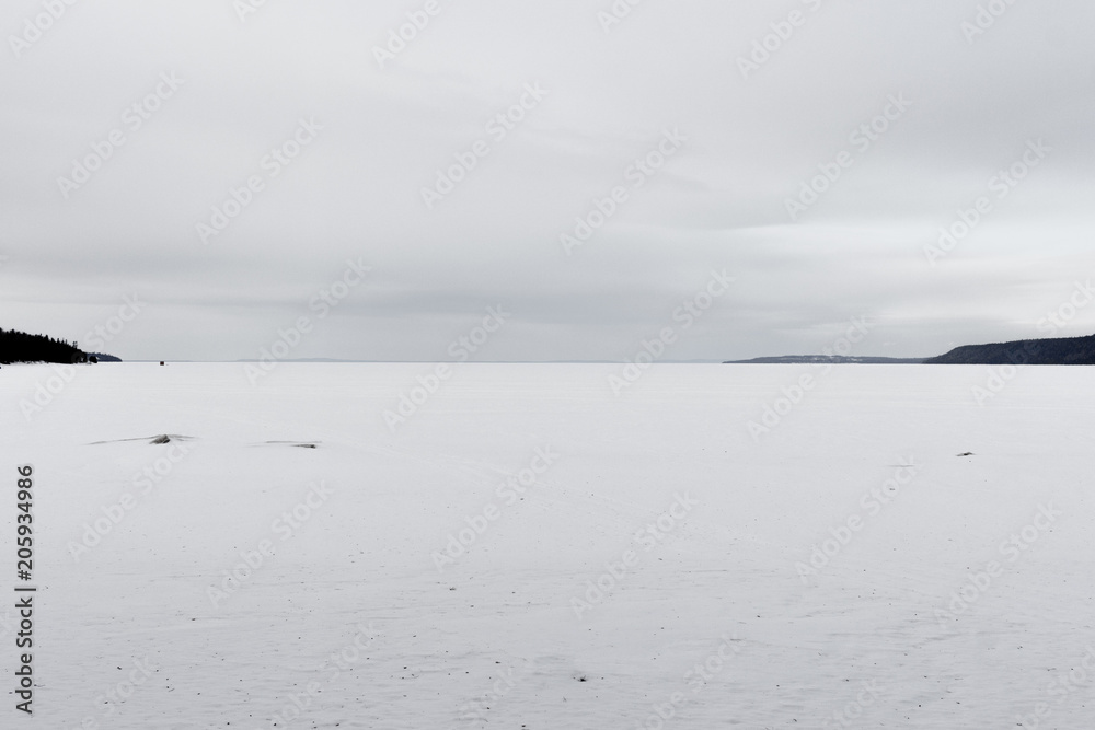 Lake surface covered with ice and snow