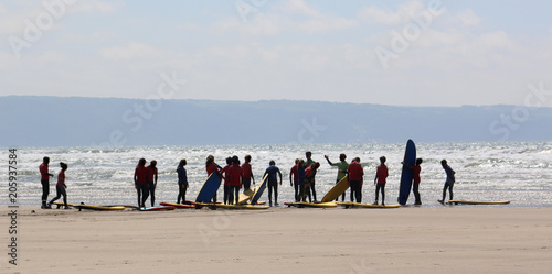 Surfers on Westward Ho beach