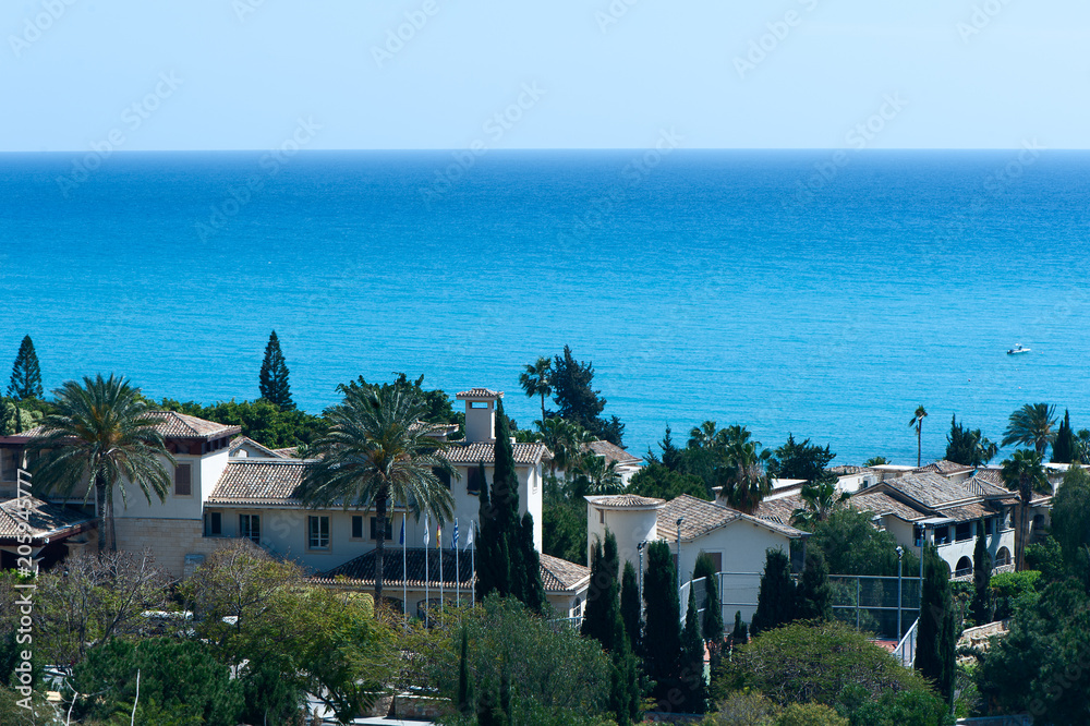 Panorama of a picturesque village in flowers on the beach