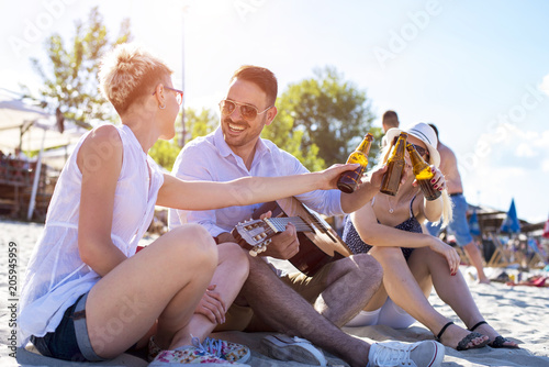 Group of friends having fun on the beach  © Drpixel