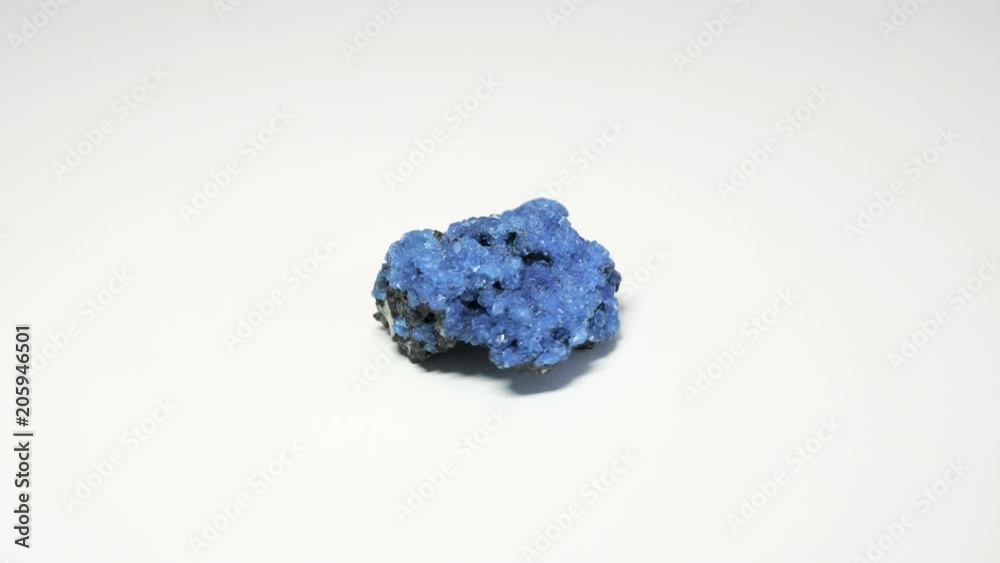 Macro shot of alum mineral isolated over white background and spinning around Macro shot of alum mineral isolated over white background and spinning around