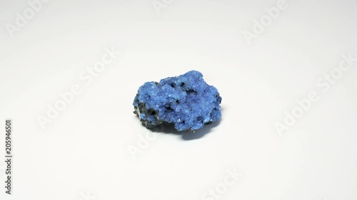 Macro shot of alum mineral isolated over white background and spinning around