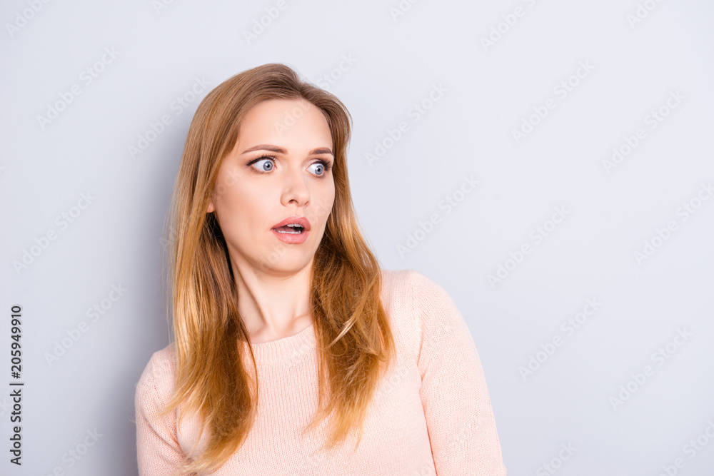 Staring eyes unbelievable people person concept. Close up portrait of pretty woman with big eyes looking aside on empty blank place near shoulder dressed in casual clothes isolated gray background Staring eyes unbelievable people person concept. Close up portrait of pretty woman with big eyes looking aside on empty blank place near shoulder dressed in casual clothes isolated gray background