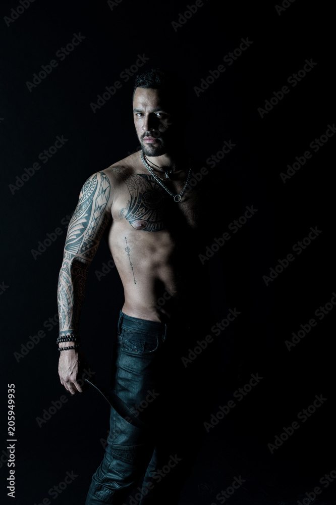 Athlete or sportsman with muscular chest and belly. Tattoo model