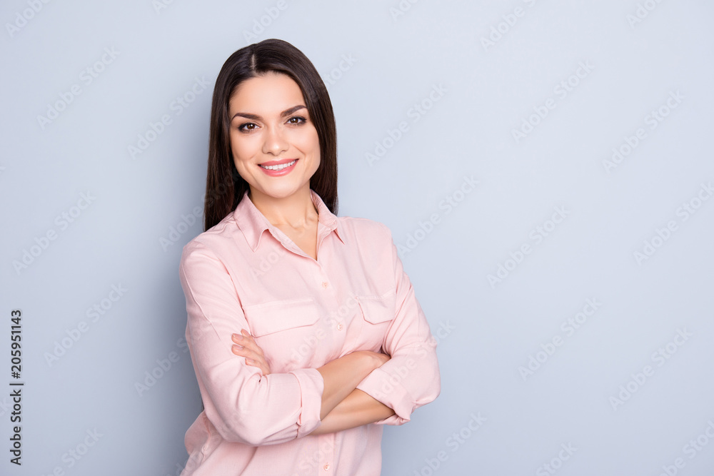 Portrait of pretty, charming, cute, trendy woman in classic shirt having her arms crossed looking at camera isolated on grey background with copy space empty place Portrait of pretty, charming, cute, trendy woman in classic shirt having her arms crossed looking at camera isolated on grey background with copy space empty place