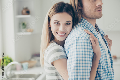 Cropped portrait of charming woman hugging handsome half-face man with stubble. True feelings love story people concept