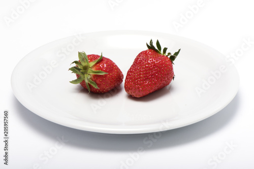 the whole strawberry on a plate