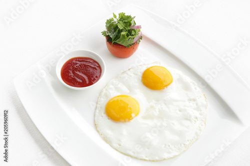 Sunny side up eggs served in the restoraunt for breakfast