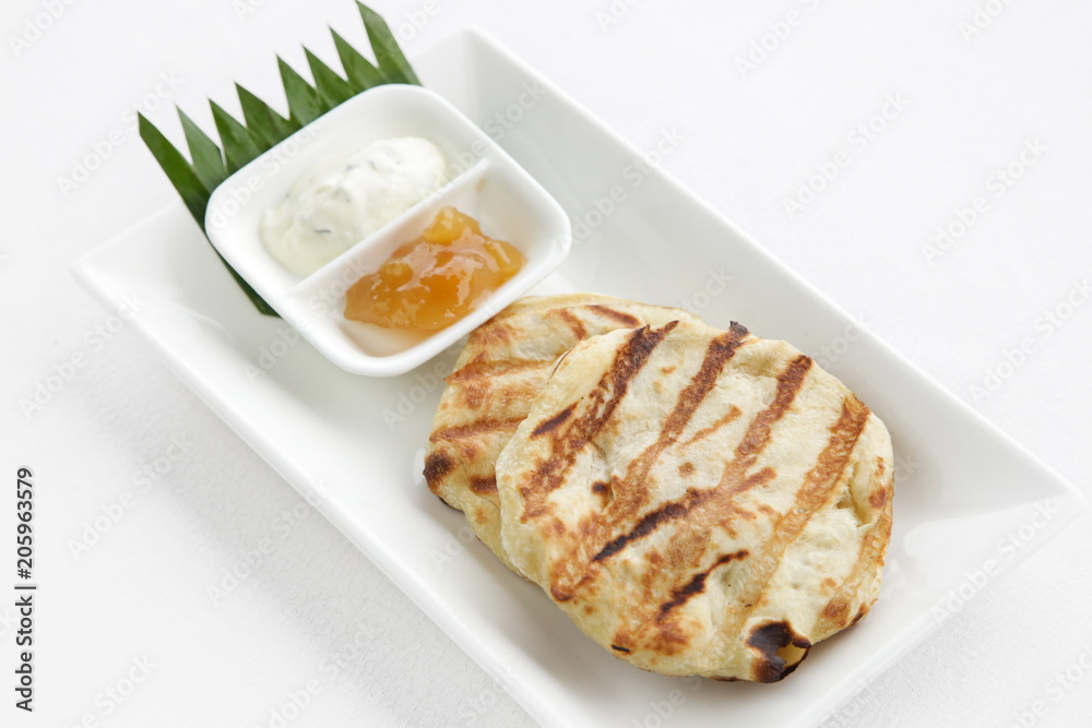 Flatbread served on the restaurant table Flatbread served on the restaurant table