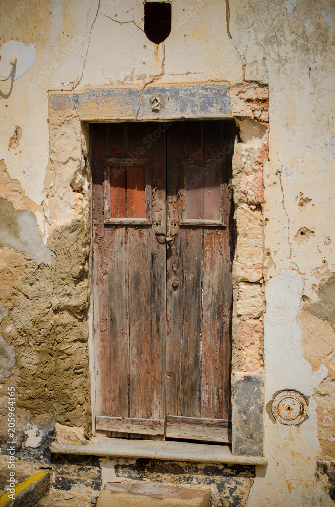 Old door in the architecture of the city Tavira, Portugal