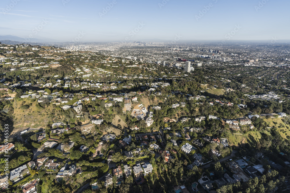 Fototapeta premium Aerial view of hillside and canyon homes above Beverly Hills and West Hollywood in Los Angeles California. 